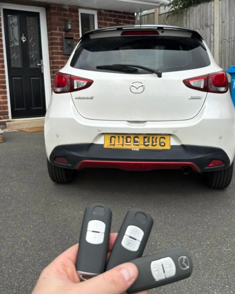 Two new car keys programmed to replace a faulty fob